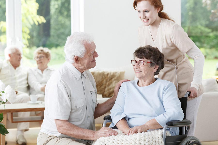 A woman with dementia interacting with others