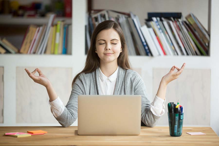 A woman sitting at a computer