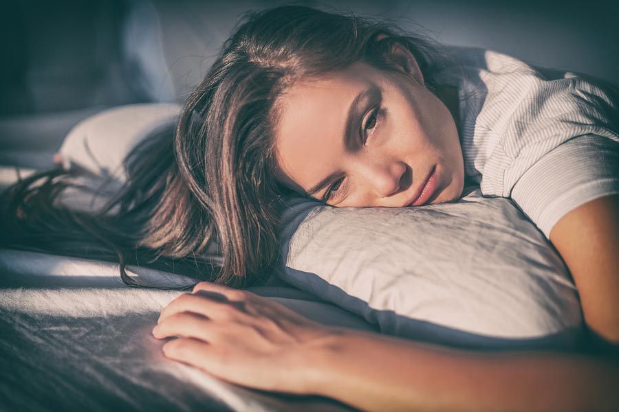 A depressed woman laying down