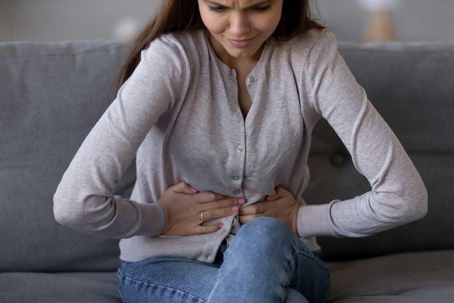 A woman in obvious pain from IBS