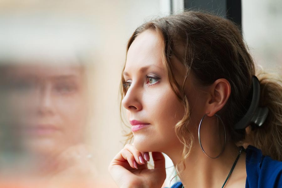 A woman contemplating her future after breast cancer.